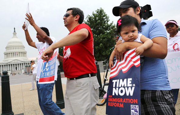 A group of immigrants and activists for immigration reform chant as they march on Capitol Hill in Washington June 26 to urge Congress to act on immigration reform. The U.S. Senate overwhelmingly passed a comprehensive immigration reform bill June 27. (CN S/Jonathan Ernst, Reuters)