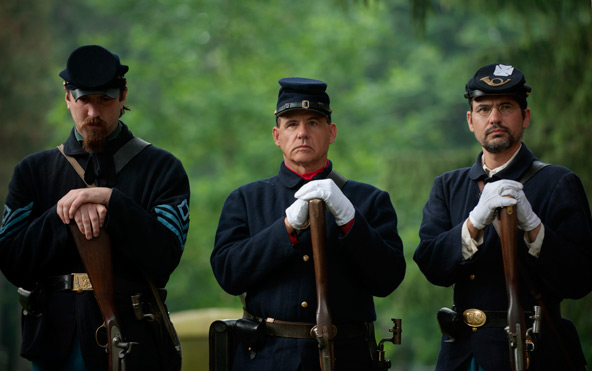 Michael O'Connor, Tracey Aiello and Jeff Holowka, members of the 140th New York Volunteer Infantry Living History Organization, take part in a memorial dedication for Civil War hero Col. Patrick O'Rorke at Holy Sepulchre Cemetery in Rochester, N.Y., July 2. O'Rorke, who died July 2, 1863, during the the Battle of Gettysburg, Pa., grew up in Rochester and is buried at Holy Sepulchre. (CNS photo/Mike Crupi, Catholic Courier)