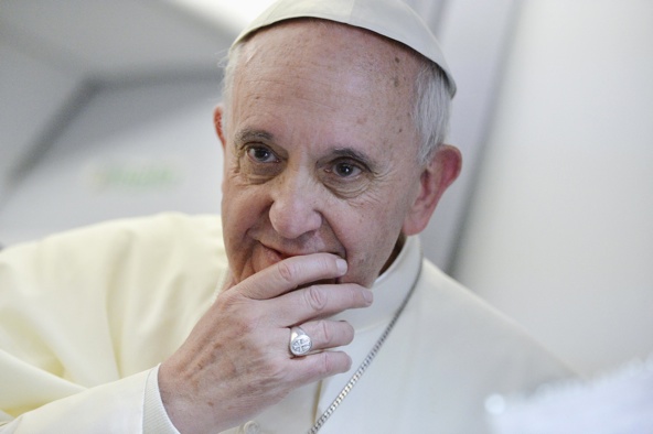 Pope Francis listens to questions from  journalists on his flight heading back to Rome July 29. The pope answered questions from 21 journalists over a period of 80 minutes on his return from Brazil. (CNS photo/pool via Reuters)