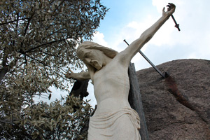The Yarnell Hill fire burned most of the wooden cross on which a large corpus hangs at St. Joseph Shrine. The flames destroyed the gift shop and seared other parts of the Stations of the Cross, which are set up among boulders. (J.D. Long-García/CATHOLIC SUN)
