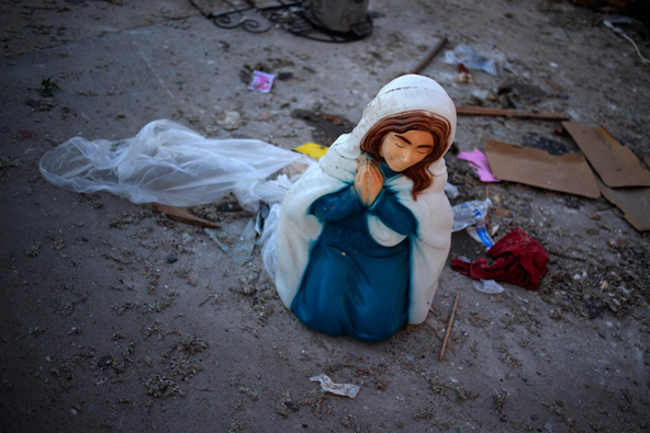 A statue of Mary sits in the front yard of a damaged house in Moore, Okla., May 21, the day after a massive tornado devastated the town. (CNS photo/Adrees Latif, Reuters)