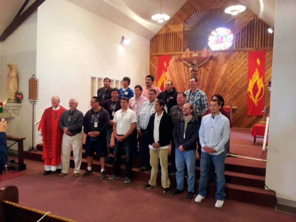Fr. Kohler with candidates after Mass concluding Cursillo.