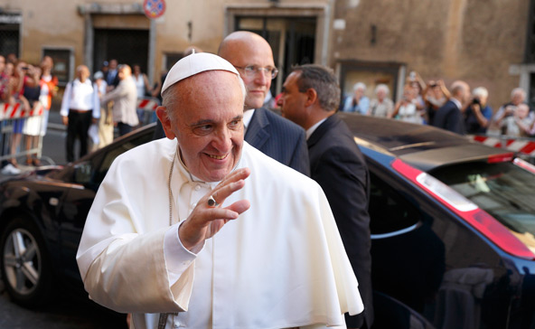 Pope Francis greets the crowd as he arrives to celebrate a private Mass at the Church of the Gesu in Rome July 31. (CNS photo/Paul Haring)