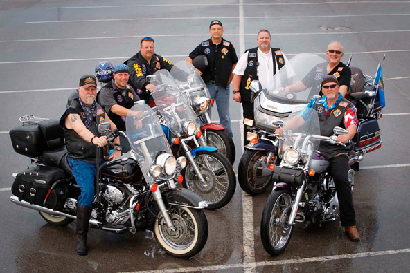 Knights on Bikes from the Diocese of Tulsa, Okla., pose for a photo in Tulsa in May. Pictured from left are Charlie Hoy and Matt Buckendorf from Holy Family, Jerry Smittle, Al Yowell from St. Anne, state chaplain Father Jim Caldwell, state president Mark Cearley and Bob Mogelnicki from St. Bernard. Theirs is a motorcycle ministry dedicated to improving the image of bikers and promoting safety and Christian values. (CNS photo/Dave Crenshaw, Eastern Oklahoma Catholic)