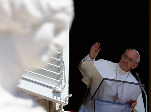 Pope Francis waves as he arrives to lead the Angelus from the window of his studio overlooking St. Peter's Square at the Vatican Aug 11. (CNS photo/Stefano Rellandini, Reuters)