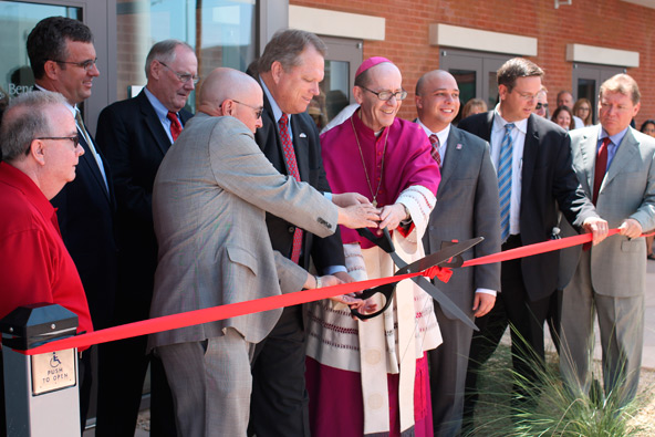 Bishop Thomas J. Olmsted joins Mesa Mayor Scott Smith and Dr. William Carroll, president of Benedictine University, during the Aug. 27 ribbon cutting ceremony. 