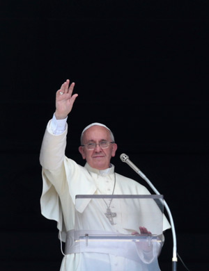 Pope Francis waves as he leads the Angelus in St. Peter's Square at the Vatican Sept. 1. (CNS photo/Tony Gentile, Reuters) 