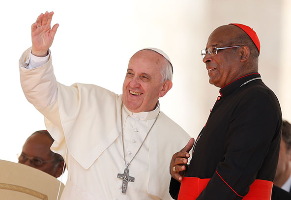 Pope Francis waves to a pilgrimage group led by Cardinal Wilfrid Napier of Durban, South Africa, right, during the general audience in St. Peter's Square at the Vatican Sept. 25. (CNS photo/Paul Haring)