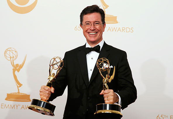 Stephen Colbert of Comedy Central's "The Colbert Report" poses with his Emmys during the Academy of Television Arts & Sciences awards show in Los Angeles in September. The Catholic comedian headlined the 68th annual dinner of the Alfred E. Smith Memorial Foundation Oct. 17 in New York. (CNS photo/Lucy Nicholson, Reuters)