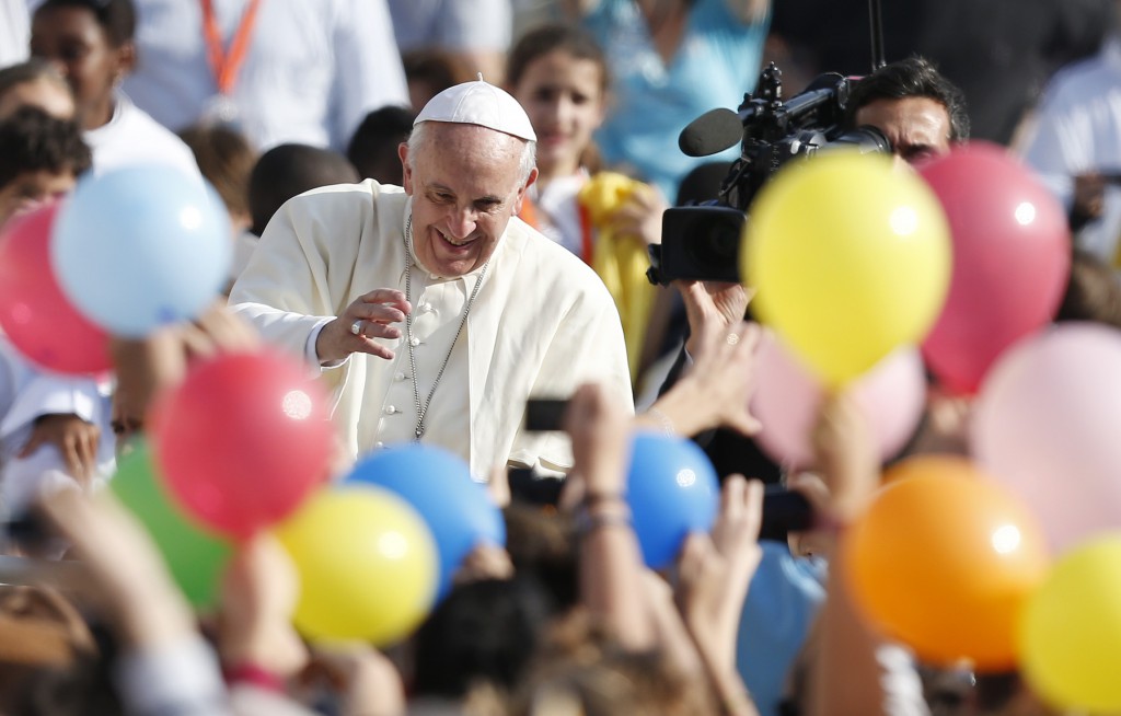 Pope Francis is pictured through balloons as he arrives to lead his general audience in St. Peter's Square at the Vatican Oct. 30. (CNS photo/Paul Haring)