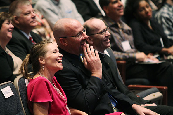 Mike Phelan, who helped organize the marriage conference, enjoys a moment of levity with his wife Sharon and Bishop Thomas J. Olmsted Sept. 28.  (Jeff Fuentebella/CATHOLIC SUN)