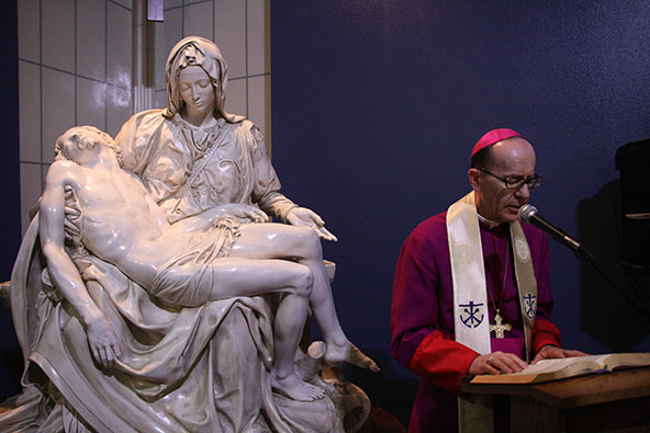 Bishop Thomas J. Olmsted is on hand to dedicate an exact replica of Michelangelo's "Pieta" at the Society of St. Vincent de Paul. (Kevin Theriailt/CATHOLIC SUN)