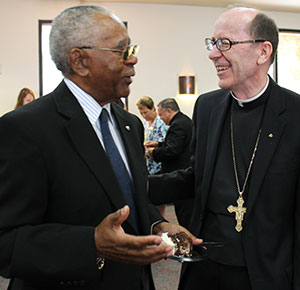 Kit Marshall shares a laugh with Bishop Thomas J. Olmsted after receiving his award. (J.D. Long-Garcia/CATHOLIC SUN)