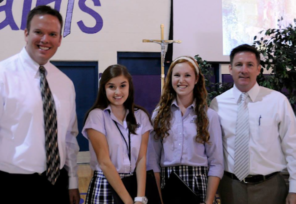 National Hispanic Scholar Award winners from Notre Dame Preparatory Lexi Boden and Alison Heredia, center with Jerome Zander, assistant principal, left and Jim Gmelich, principal, right (courtesy photo).