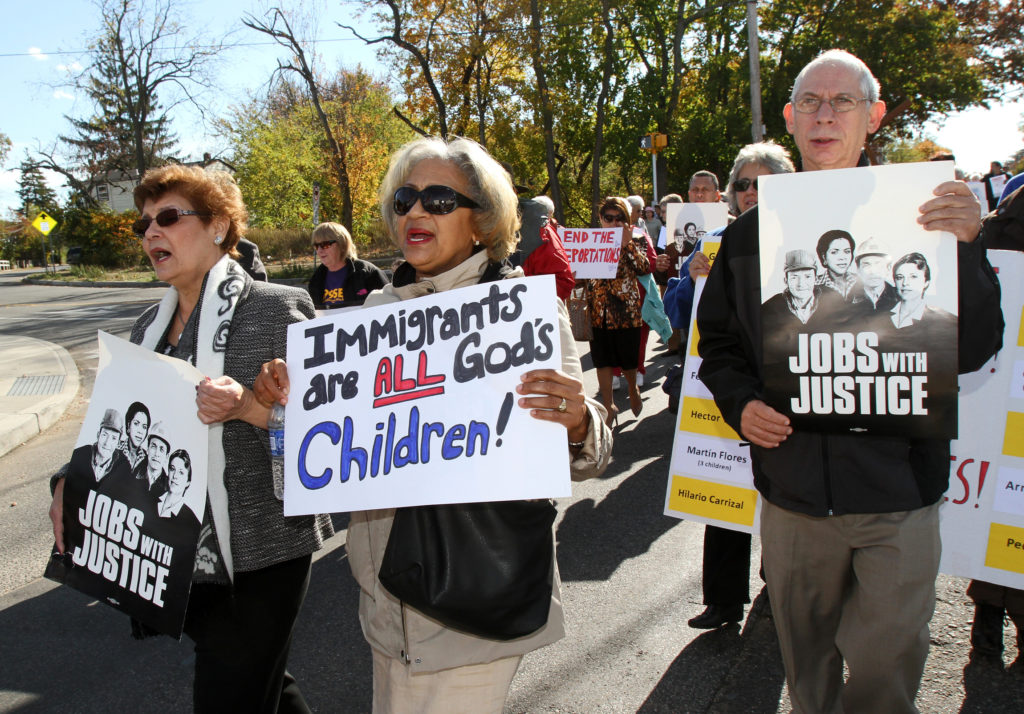 People participate in an interfaith march and rally for comprehensive immigration reform in Wyandanch, N.Y., Oct. 27. Demonstrators demanded an end to unjust deportations and urged Congress to support a path to citizenship for an estimated 11 million undocumented immigrants in the U.S. (CNS photo/Gregory A. Shemitz)