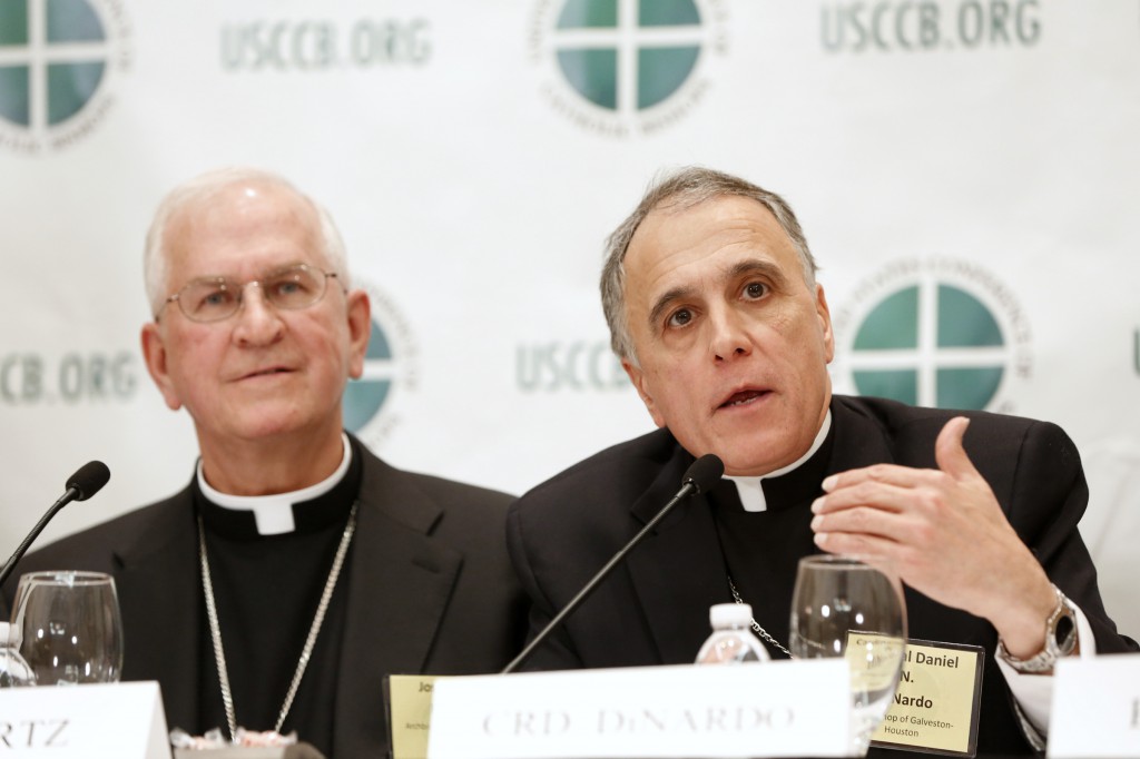 Cardinal Daniel N. DiNardo of Galveston-Houston addresses a news conference during the annual fall meeting of the U.S. Conference of Catholic Bishops Nov. 12 in Baltimore. At left is the newly elected president of the USCCB, Archbishop Joseph E. Kurtz of Louisville, Ky. Cardinal DiNardo was elected vice president. (CNS photo/Nancy Phelan Wiechec)