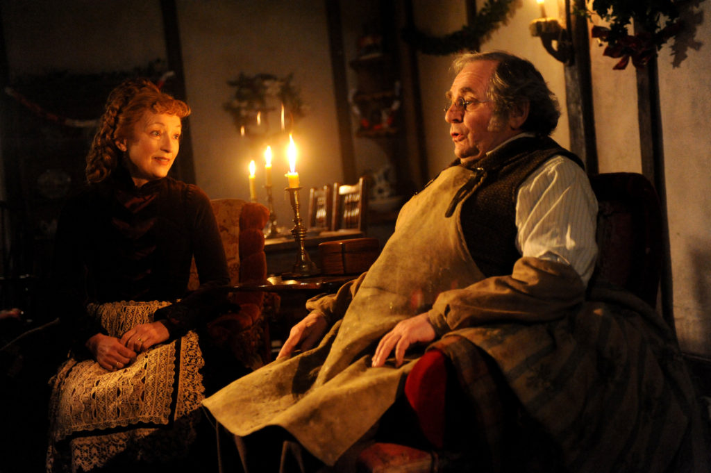 Lesley Manville and Sylvester McCoy star in a scene from the EchoLight Studios production "The Christmas Candle." This past June, Rick Santorum, the former U.S. senator from Pennsylvania and a 2012 presidential candidate, became CEO of the Dallas-based production studio whose mission is to develop faith-based films. (CNS photo/EchoLight Studios) 