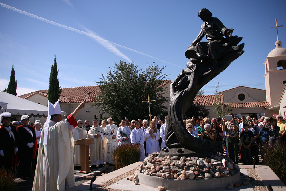 Auxiliary Bishop Eduardo A. Nevares blesses a statue of St. Stephen at St. Steven Parish in Sun Lakes. The bishop celebrated a Mass commemorating the parish’s 25th anniversary Oct. 27. (Kevin Theriault/CATHOLIC SUN)