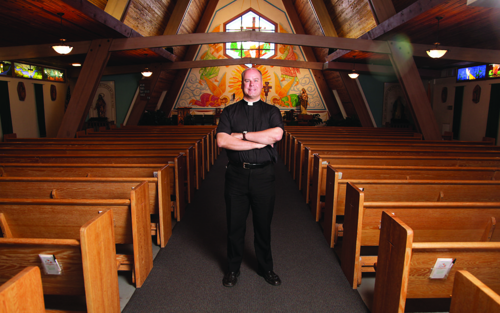 Fr. Kilian McCaffrey, pictured here inside St. Joseph the Worker in Williams, is hoping Polar Express passengers will attend Mass at the parish. 