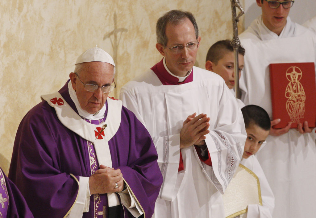 Pope Francis celebrates Mass as he visits the Parish of San Cirillo Alessandrino in Rome Dec. 1. (CNS photo/Paul Haring)