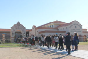 Donors and grandparents file into the courtyard of the completely rebuilt St. Francis Xavier campus. (Ambria Hammel/CATHOLIC SUN)