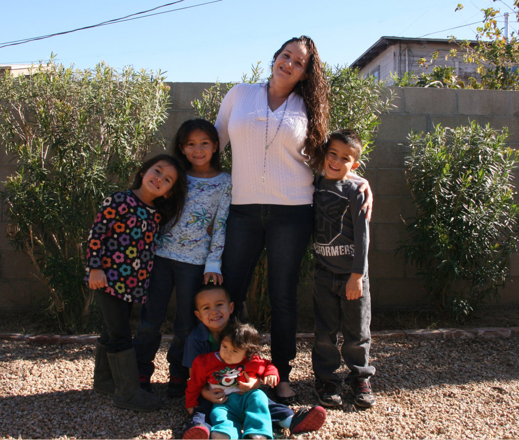 Silvia with her five children at one of the Maggie’s Place homes. Maggie’s Place benefits from the year-end tax credit. 