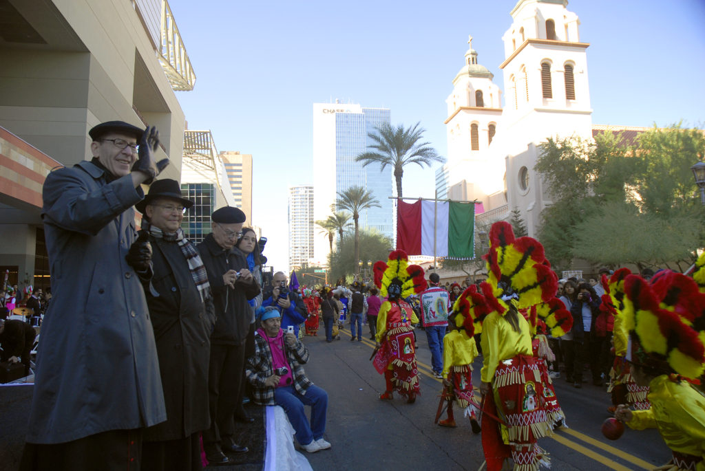 Bishop Thomas J. Olmsted and Auxiliary Bishop Eduardo A. Nevares greet matchines during the Dec. 7 Honor Your Mother celebration of Our Lady of Guadalupe in downtown Phoenix. (Tamara Tirado/CATHOLIC SUN)
