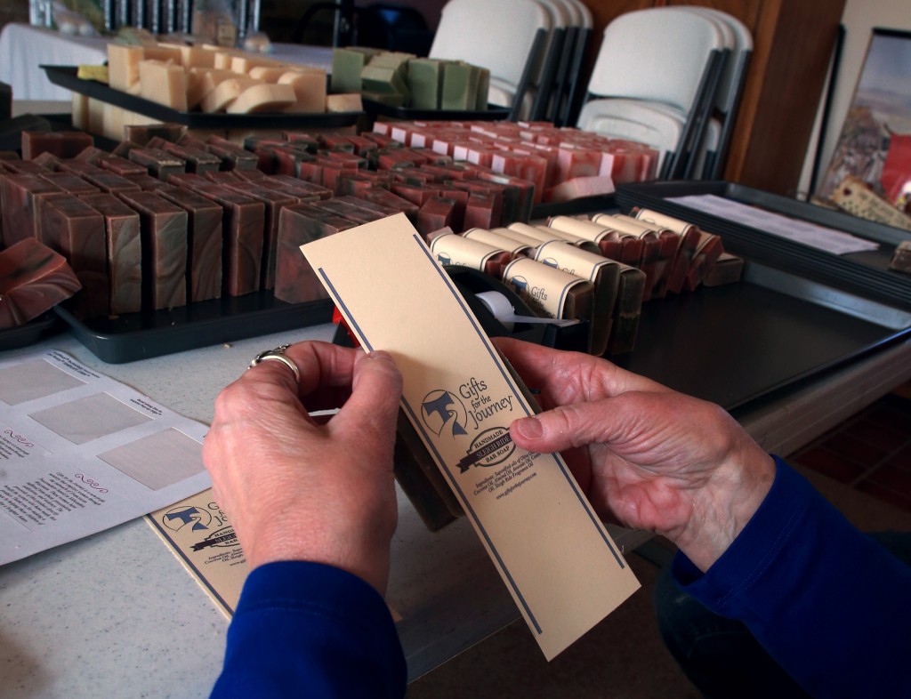 Joy Stadther wraps soaps handcrafted by Franciscan Peacemakers Dec. 9 at the ministry's headquarters in Milwaukee. The soaps and other bath products are sold to help fund the program that helps women engaged in prostitution. (CNS photo/Allen Fredrickson, Catholic Herald)