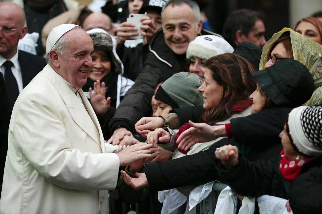 Pope Francis greets people as he arrives for a pastoral visit to the Basilica of the Sacred Heart of Jesus in Rome Jan. 19. (CNS photo/Tony Gentile, Reuters)