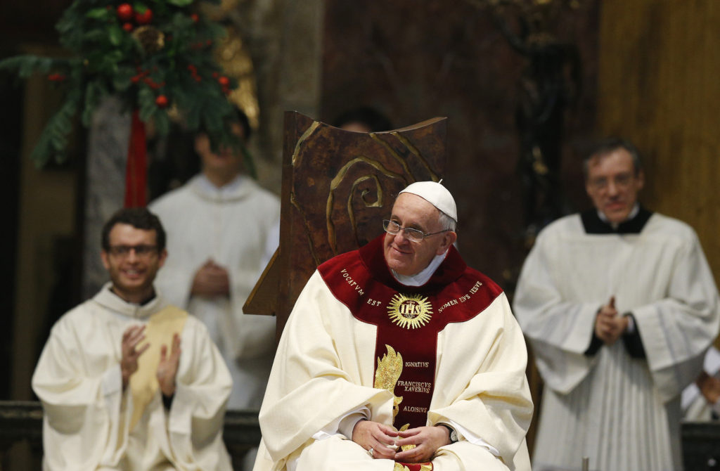Pope Francis smiles during Mass at the Church of the Gesu in Rome Jan. 3. The Mass was celebrated on the feast of the Most Holy Name of Jesus in thanksgiving for the recent canonization of Jesuit St. Peter Faber. (CNS photo/Paul Haring)