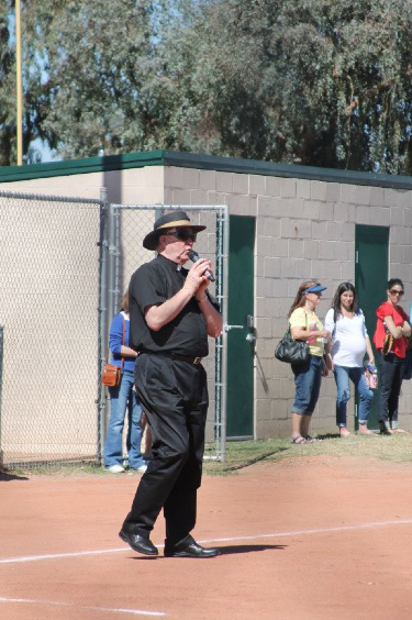 Jesuit Father Dan Sullivan leads prayer on opening day of the St. Francis Xavier Athletic Association's baseball/softball season in this 2013 file photo. The league attracts students from across the Valley. (Ambria Hammel/CATHOLIC SUN)