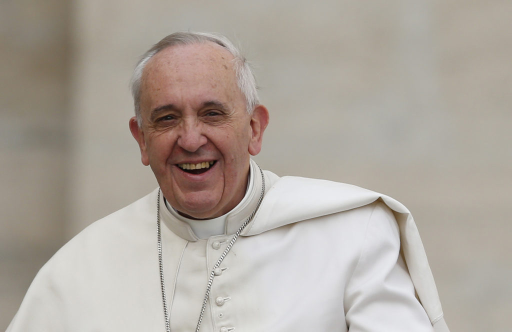 Pope Francis smiles as he arrives to lead his general audience in St. Peter's Square at the Vatican Feb. 19. (CNS photo/Paul Haring) 