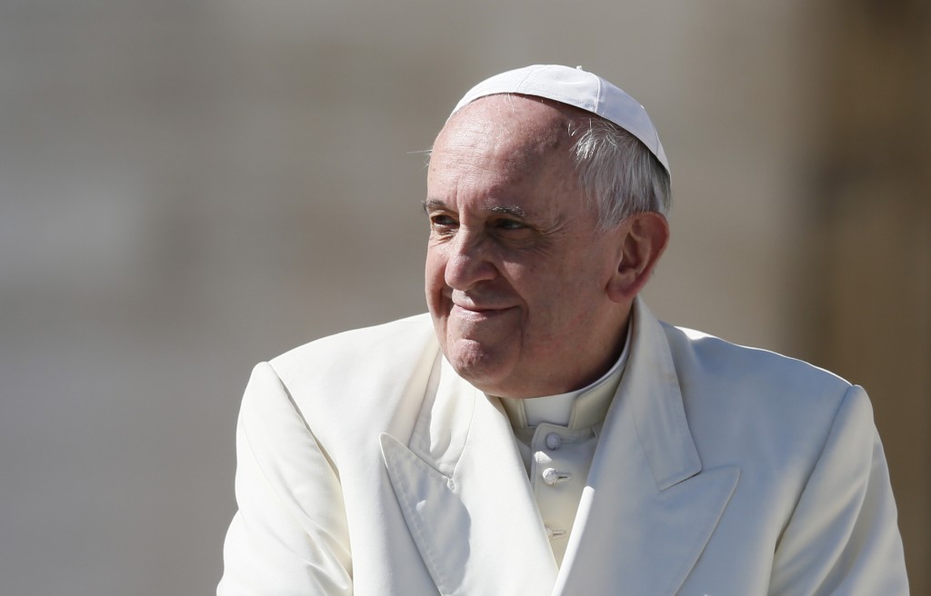 Pope Francis smiles as he leaves his general audience in St. Peter's Square at the Vatican March 5. (CNS photo/Paul Haring)