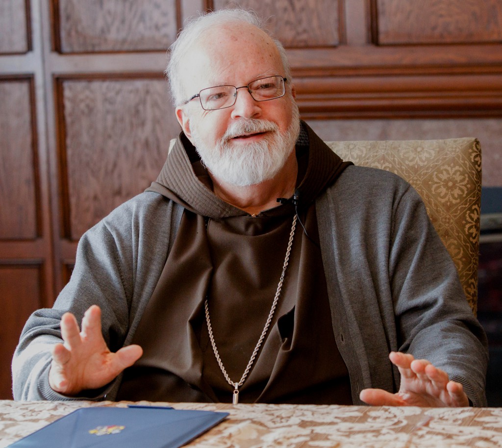 Boston Cardinal Sean P. O'Malley gestures during a March 4 interview at his residence, the rectory of the Cathedral of the Holy Cross. Cardinal O'Malley said with his "refreshing style" and accessibility, Pope Francis' impact on the world is "amazing." (CNS photo/Gregory L. Tracy, The Pilot)