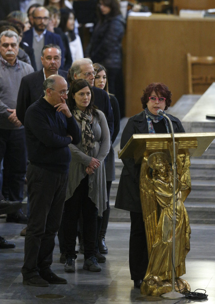 People read names of Mafia victims at Rome's Church of St. Gregory VII March 21 after a papal prayer service. (CNS photo/Paul Haring)