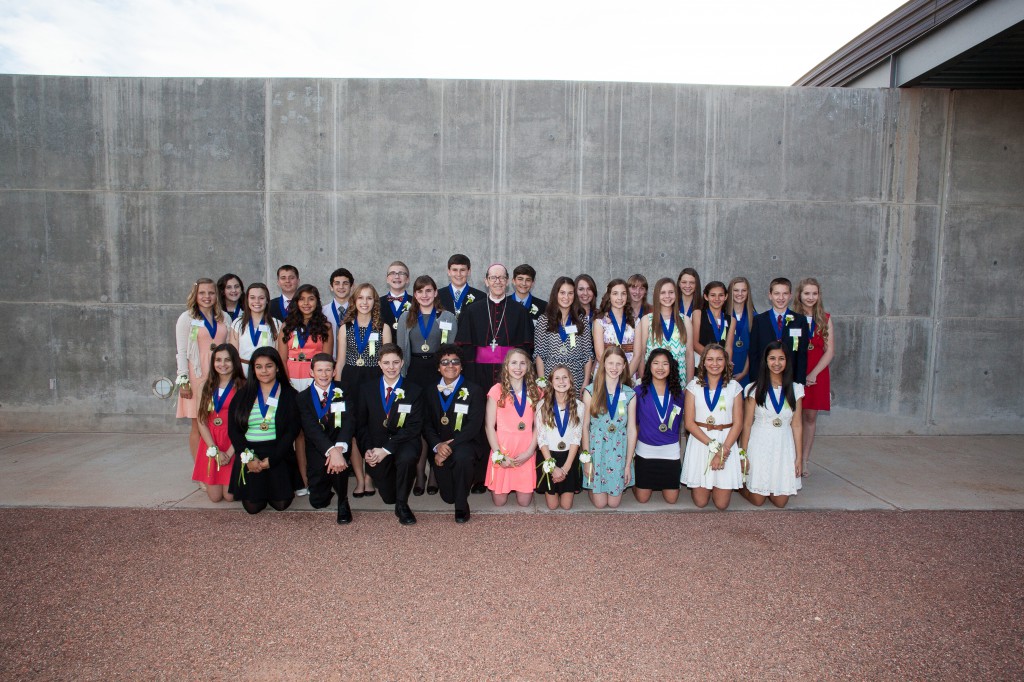 Bishop Thomas J. Olmsted is seen here with Christian Service Award recipients March 4 outside the Tempe Center for the Arts. The eighth-graders are headed to a Catholic high school with an $8,000 scholarship.