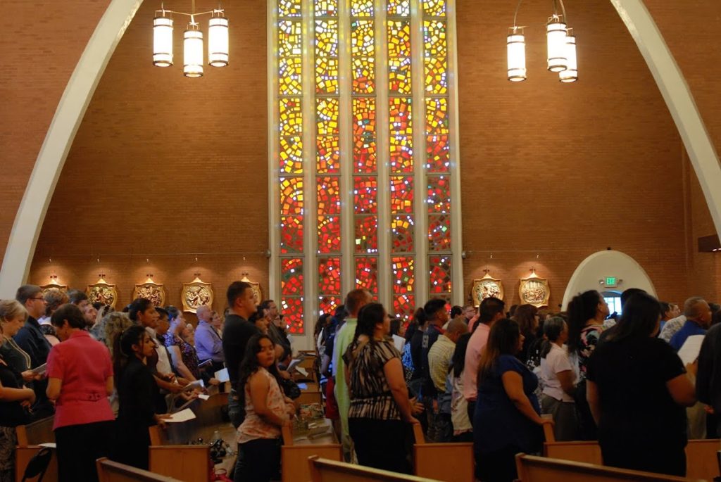 Catechumens, surrounded by family, friends and sponsors, packed into Ss. Simon and Jude Cathedral March 9. From now until their entrance into the Church at the Easter Vigil April 19, they are known as the Elect. (Tamara Tirado/CATHOLIC SUN)