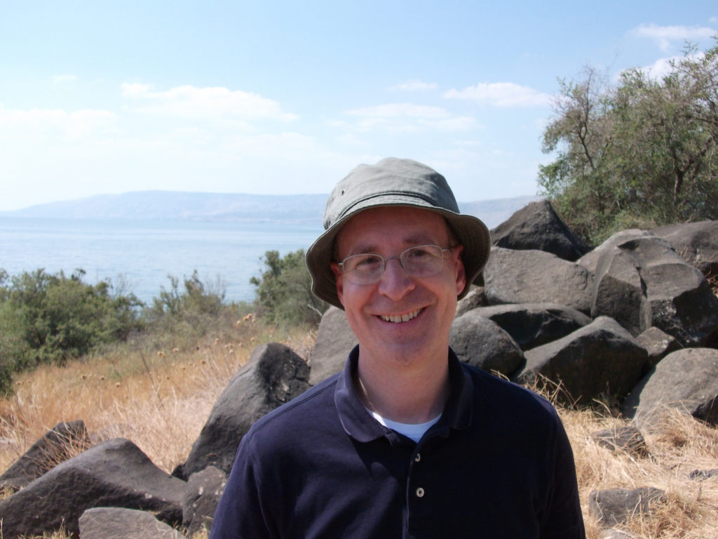 Jesuit Father James Martin is pictured in 2011 by the "Bay of Parables" at the Sea of Galilee. The priest, a popular author and editor at large of America, the Jesuits' national magazine, told Catholic News Service in an interview he has a hard time believing that he initially turned down a suggestion to go to Jerusalem as source material for his newest book, "Jesus: A Pilgrimage." (CNS photo/courtesy Father Martin)