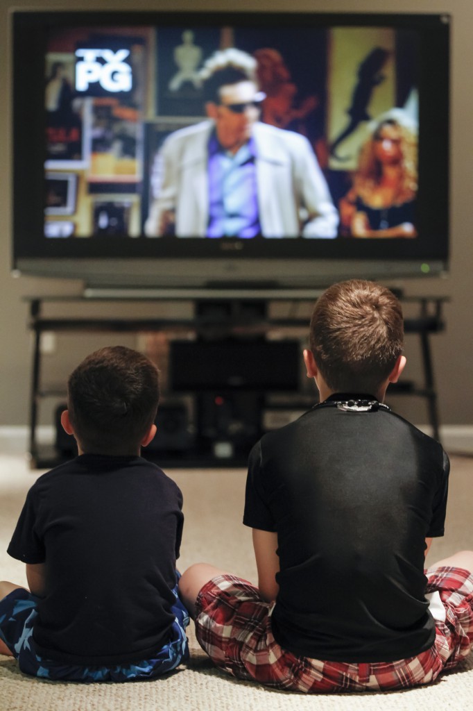 Boys watch TV at their home in Chesapeake Beach, Md., in this 2013 file photo. (CNS photo/Bob Roller)