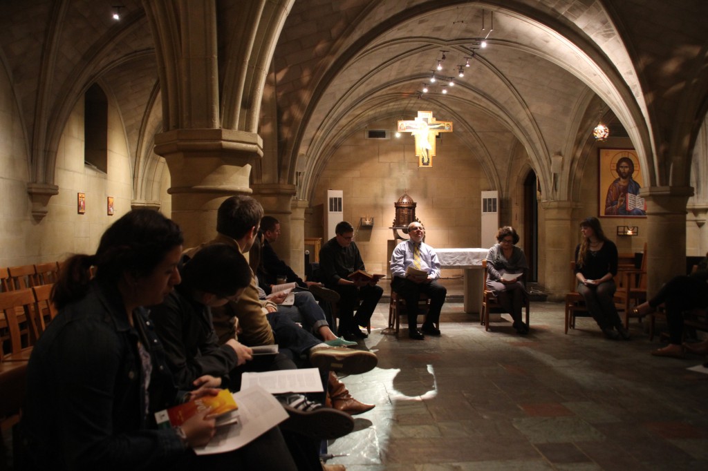 Ennio Mastroianni, center, helps lead a group of catechumens with Father Patrick Rogers and Minerva San Juan in Copley Crypt Chapel of the North American Martyrs at Georgetown University in Washington Feb. 20. The students are enrolled in the Rite of Christian Initiation for Adults, the process by which people receive instruction in the Catholic faith and are received into the church. (CNS photo/Ashleigh Buyers) 