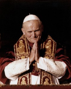 Pope John Paul II appears from St. Peter's Basilica following his election the evening of Oct. 16, 1978. The conclave chose 58-year-old Polish Cardinal Karol Jozef Wojtyla, virtually unknown to many in the church, to succeed the short tenure of Pope John Paul I. (CNS photo/Catholic Press Photo)