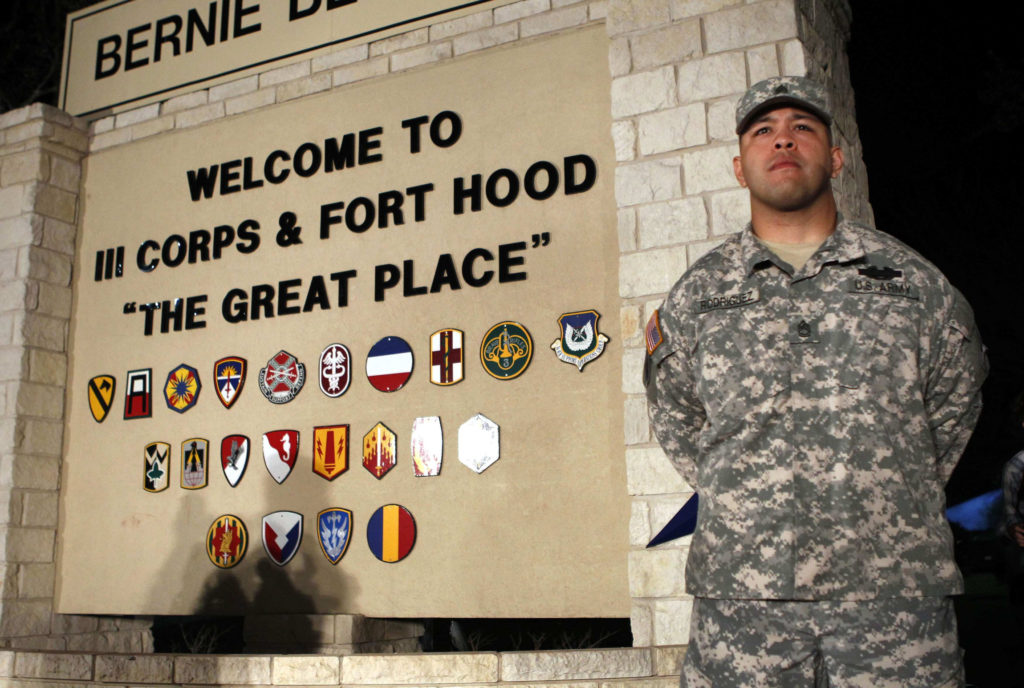 U.S. Army Sgt. 1st Class Erick Rodriguez stands guard at the entrance to Fort Hood Army Post in Texas before a news conference  April 2. An Iraq War veteran who was being treated for mental health issues gunned down three colleagues at Fort Hood and injured 16 others before killing himself that day, authorities said. (CNS photo/Erich Schlegel, Reuters)  