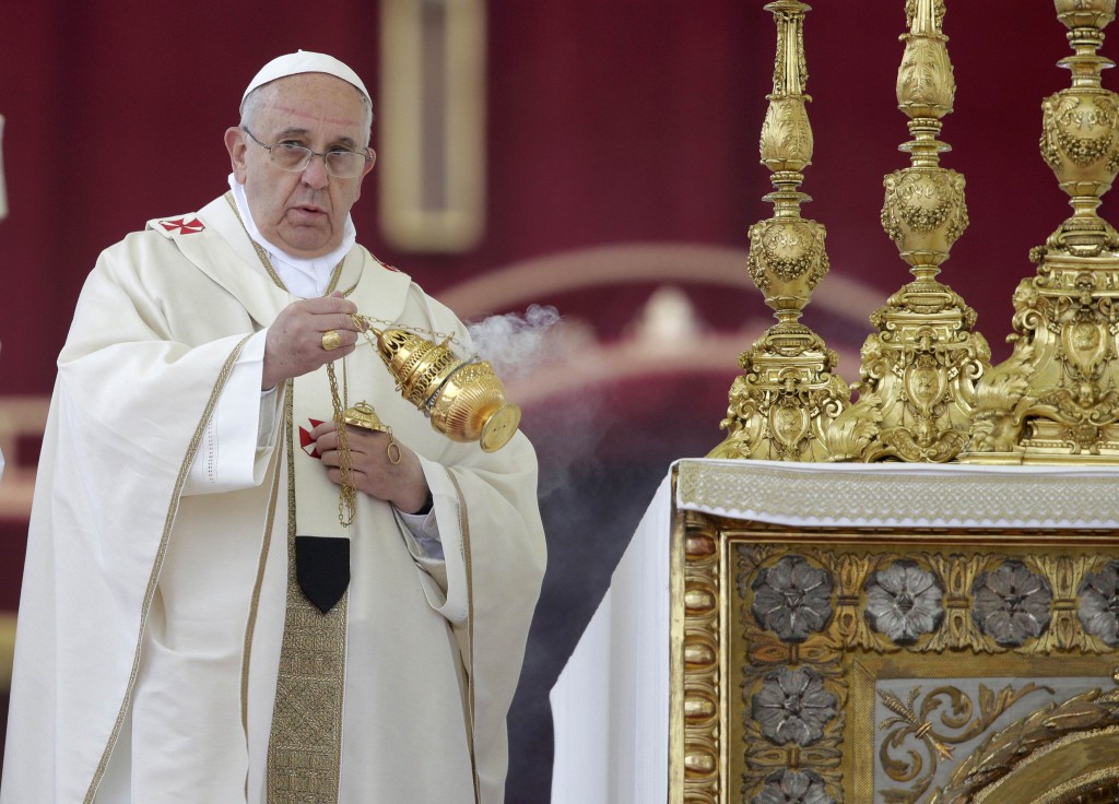 Pope Francis swings a censer as he celebrates Mass during the canonizations of Sts. John XXIII and John Paul II in St. Peter's Square at the Vatican April 27. (CNS photo/Max Rossi, Reuters)