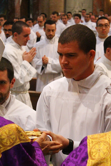 Phoenix seminarian Dan Connealy receives the paten and __ as he is instituted to the ministry of acolyte in Rome April 6. (photo courtesy of PNAC Photo Service)