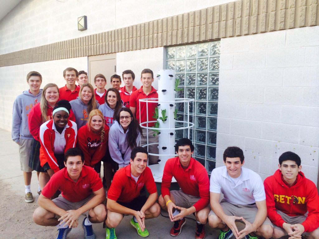The "Green Team" at Seton College Preparatory High School in Chandler poses near its tower garden (photo courtesy of Seton)