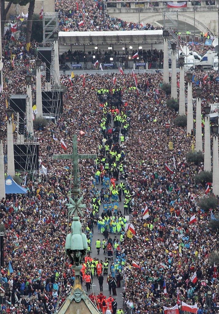 People pack Via della Conciliazione, the main road leading to the Vatican, during the canonization Mass of Sts. John XXIII and John Paul II in St. Peter's Square at the Vatican April 27. (CNS photo/Evandro Inetti, pool)