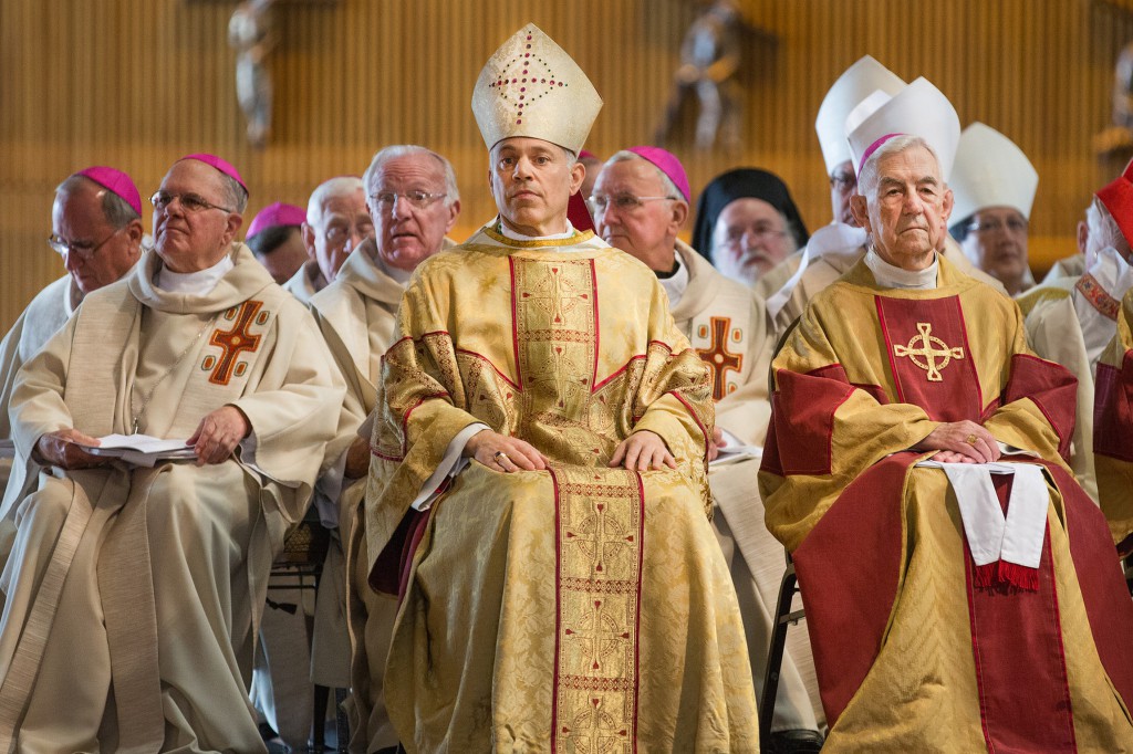 Archbishop Salvatore J. Cordileone, center, and retired Archbishop John R. Quinn of San Francisco, right, look on during Archbishop Cordileone's installation Mass at the Cathedral of St. Mary of the Assumption Oct. 4. He succeeds Archbishop George H. Niederauer, 76, who had headed the San Francisco Archdiocese since 2005. (CNS photo/Dennis Callahan, Catholic San Francisco) 