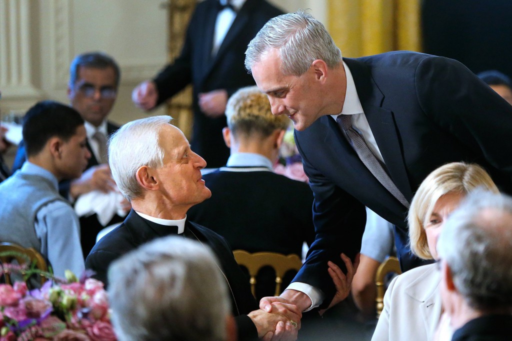 Cardinal Donald W. Wuerl of Washington is greeted by White House Chief of Staff Denis McDonough at an Easter prayer breakfast in the East Room of the White House in Washington April 14. The breakfast, a tradition begun by U.S. President Barack Obama and held around Easter each year, brings together Christian religious leaders from across the country, both prominent and grass-roots workers.(CNS photo/Jonathan Ernst)