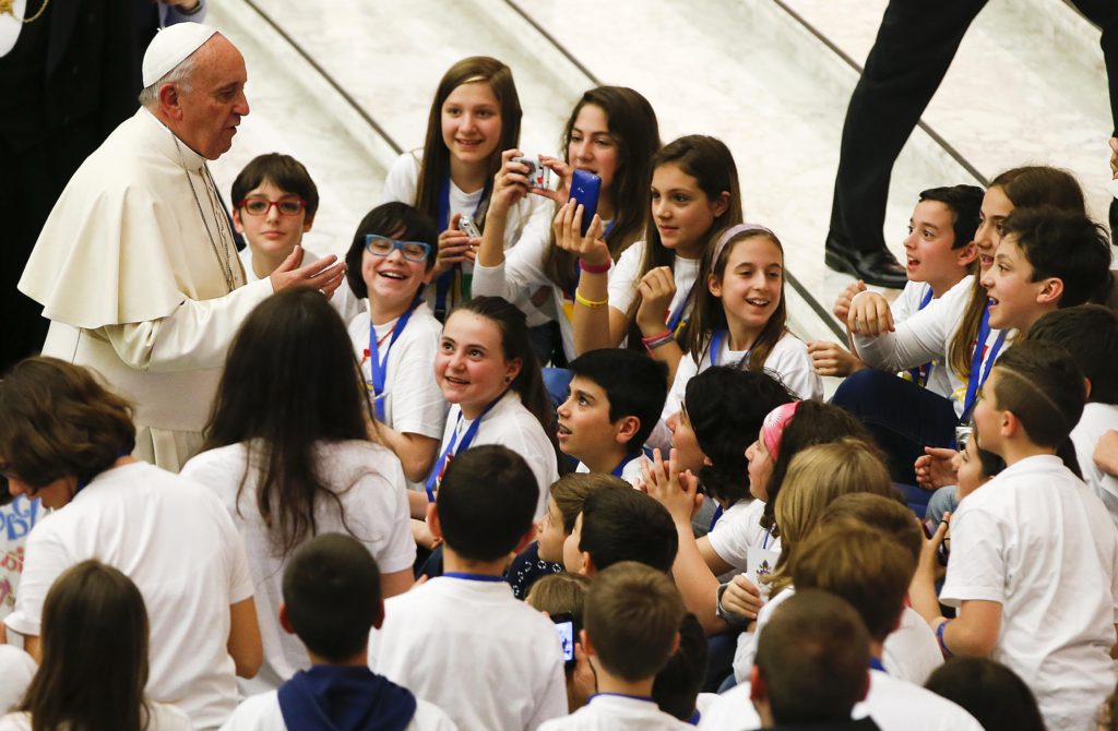 Pope Francis talks with young people during a special audience with members of the "Catholic Action" in Paul VI hall at the Vatican May 3. (CNS photo/Tony Gentile, Reuters)