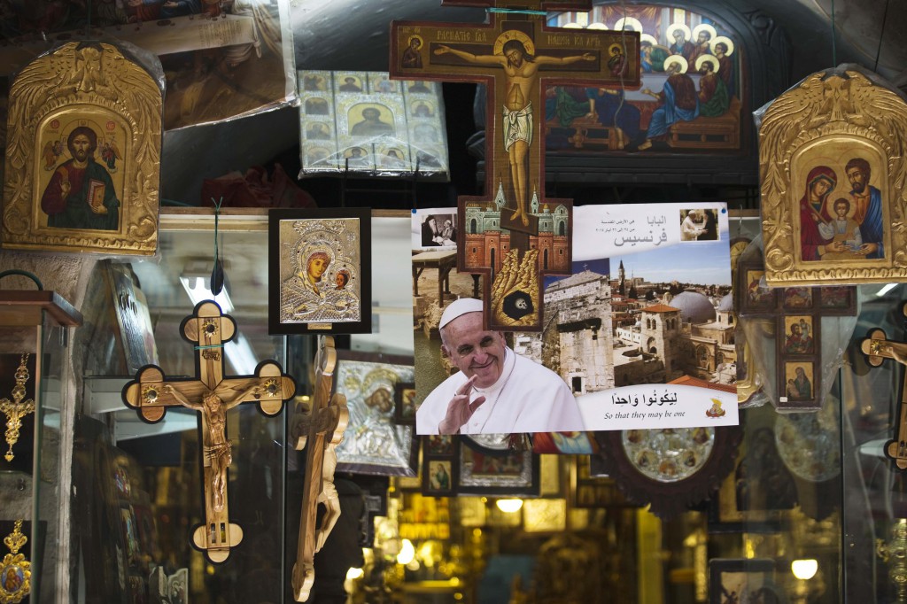 A poster of Pope Francis is displayed at a shop in Jerusalem's Old City May 16. Pope Francis will visit Jordan, the Palestinian Territories and Israel during his May 24-26 trip, his first as pope to the region. (CNS photo/Amir Cohen)